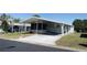 Well-maintained single-story home with a covered carport and a convenient ramp at 34045 Brown Bayou, Wesley Chapel, FL 33543