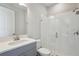 Modern bathroom featuring a glass-enclosed shower and a vanity with a quartz countertop at 3437 Yellow Leaf Cir, Spring Hill, FL 34609