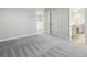 Large bedroom shows open entrance to a bathroom and doorway to upstairs landing at 3437 Yellow Leaf Cir, Spring Hill, FL 34609