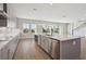 Bright kitchen featuring stainless steel appliances, a center island, and ample counter space at 3437 Yellow Leaf Cir, Spring Hill, FL 34609