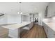Stylish kitchen with a large island, stainless appliances, and modern lighting fixtures at 3437 Yellow Leaf Cir, Spring Hill, FL 34609