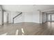 Open-concept living area with a staircase and ample natural light at 3437 Yellow Leaf Cir, Spring Hill, FL 34609