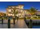 Luxury home with waterfront backyard, dock, and modern design at 490 Laguna Dr, Tierra Verde, FL 33715
