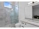 Modern bathroom with a walk-in shower, vanity, and a toilet at 490 Laguna Dr, Tierra Verde, FL 33715