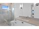 Modern bathroom with a walk-in shower, vanity, and a toilet at 490 Laguna Dr, Tierra Verde, FL 33715
