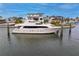 Large yacht docked at a waterfront mansion at 490 Laguna Dr, Tierra Verde, FL 33715
