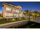 Luxury waterfront home with pool and private dock at sunset at 490 Laguna Dr, Tierra Verde, FL 33715