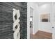 Clean hallway with unique wall decor and wood floors at 490 Laguna Dr, Tierra Verde, FL 33715