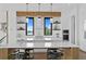 Modern kitchen with white cabinets, wood accents, and water views at 490 Laguna Dr, Tierra Verde, FL 33715