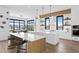 Modern kitchen with white cabinets and a large island at 490 Laguna Dr, Tierra Verde, FL 33715