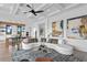 Spacious living room with large sectional sofa and modern art at 490 Laguna Dr, Tierra Verde, FL 33715