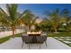 Firepit and seating area overlooking the water at 490 Laguna Dr, Tierra Verde, FL 33715