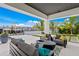 Outdoor patio furniture with fire pit and waterfront views at 490 Laguna Dr, Tierra Verde, FL 33715