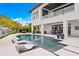 Luxury pool and patio area with waterfront access at 490 Laguna Dr, Tierra Verde, FL 33715