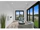 Relaxing sitting area with water views and comfy armchairs at 490 Laguna Dr, Tierra Verde, FL 33715