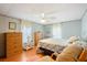 Bedroom with ceiling fan, wood flooring, and double bed at 34045 Brown Bayou, Wesley Chapel, FL 33543