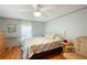 Bedroom with ceiling fan, wood floor, and a relaxing atmosphere at 34045 Brown Bayou, Wesley Chapel, FL 33543