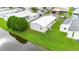 Aerial view of the home's back, highlighting the canal view and green landscaping at 34045 Brown Bayou, Wesley Chapel, FL 33543