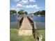 Wooden dock extending over the lake at 34045 Brown Bayou, Wesley Chapel, FL 33543