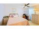 Bright bedroom with a comfortable bed and built-in workspace at 34045 Brown Bayou, Wesley Chapel, FL 33543