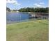 Serene lake view with dock and lush lawn at 34045 Brown Bayou, Wesley Chapel, FL 33543