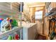 Functional laundry room with storage shelving and a washer and dryer at 34045 Brown Bayou, Wesley Chapel, FL 33543