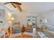 Spacious living room with hardwood floors, comfortable seating, and access to the patio at 34045 Brown Bayou, Wesley Chapel, FL 33543