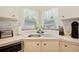 Corner kitchen sink with double basin and ample counter space at 34045 Brown Bayou, Wesley Chapel, FL 33543