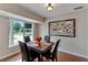 Bright dining area with a table for four and decorative wall art at 4103 24Th W Ave, Bradenton, FL 34205