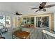 Relaxing sunroom with wicker furniture and backyard view at 4103 24Th W Ave, Bradenton, FL 34205