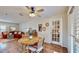 Casual dining area with round wooden table and chairs near living room at 727 Flamingo Dr, Apollo Beach, FL 33572