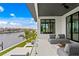 Spacious balcony overlooking the water with comfortable seating at 490 Laguna Dr, Tierra Verde, FL 33715