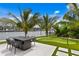 Backyard oasis with fire pit, putting green, and waterfront access at 490 Laguna Dr, Tierra Verde, FL 33715