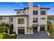 A modern, waterfront home with a three-car garage at 490 Laguna Dr, Tierra Verde, FL 33715