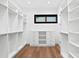 Large walk-in closet with ample shelving and hanging space at 490 Laguna Dr, Tierra Verde, FL 33715