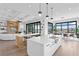 Spacious kitchen with island, white cabinets, and stainless steel appliances at 490 Laguna Dr, Tierra Verde, FL 33715
