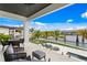 Outdoor balcony overlooking the water with seating and beautiful views at 490 Laguna Dr, Tierra Verde, FL 33715