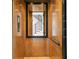 Modern elevator with wood interior, offering convenient access between floors at 490 Laguna Dr, Tierra Verde, FL 33715