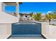Luxury pool with blue tile accents and spacious patio at 490 Laguna Dr, Tierra Verde, FL 33715