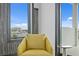 Relaxing sitting area with yellow chair and water views at 490 Laguna Dr, Tierra Verde, FL 33715
