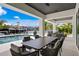 Covered patio with outdoor dining and stunning water views at 490 Laguna Dr, Tierra Verde, FL 33715