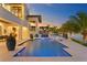 Inviting pool and patio with outdoor kitchen and plenty of seating at 490 Laguna Dr, Tierra Verde, FL 33715
