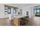 White kitchen with wood accents and breakfast bar at 490 Laguna Dr, Tierra Verde, FL 33715