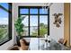 Elegant dining room showcasing a water view and modern chandelier at 490 Laguna Dr, Tierra Verde, FL 33715