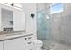 Modern bathroom with a glass shower and gray tile at 490 Laguna Dr, Tierra Verde, FL 33715