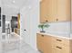 Bright hallway with modern cabinets and marble floors at 490 Laguna Dr, Tierra Verde, FL 33715