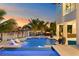 Expansive pool and patio with waterfront views and comfortable lounge chairs at 490 Laguna Dr, Tierra Verde, FL 33715