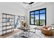 Home office with water views, built-in shelving, and comfortable seating at 490 Laguna Dr, Tierra Verde, FL 33715