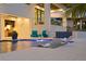 Relaxing poolside patio with outdoor kitchen and comfortable lounge chairs at 490 Laguna Dr, Tierra Verde, FL 33715