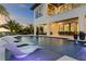 Inviting pool and lounge chairs; modern home in background at 490 Laguna Dr, Tierra Verde, FL 33715